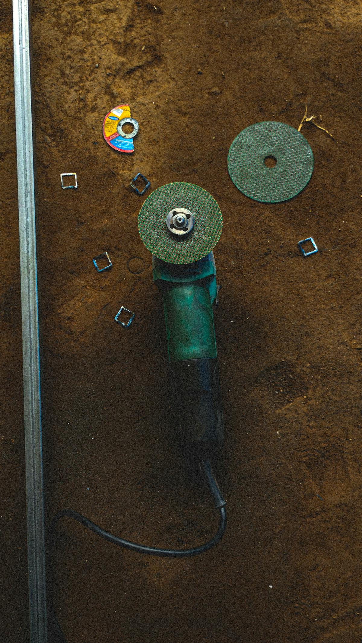 Angle grinder and diamond grinding wheels used for garage floor concrete prep steps